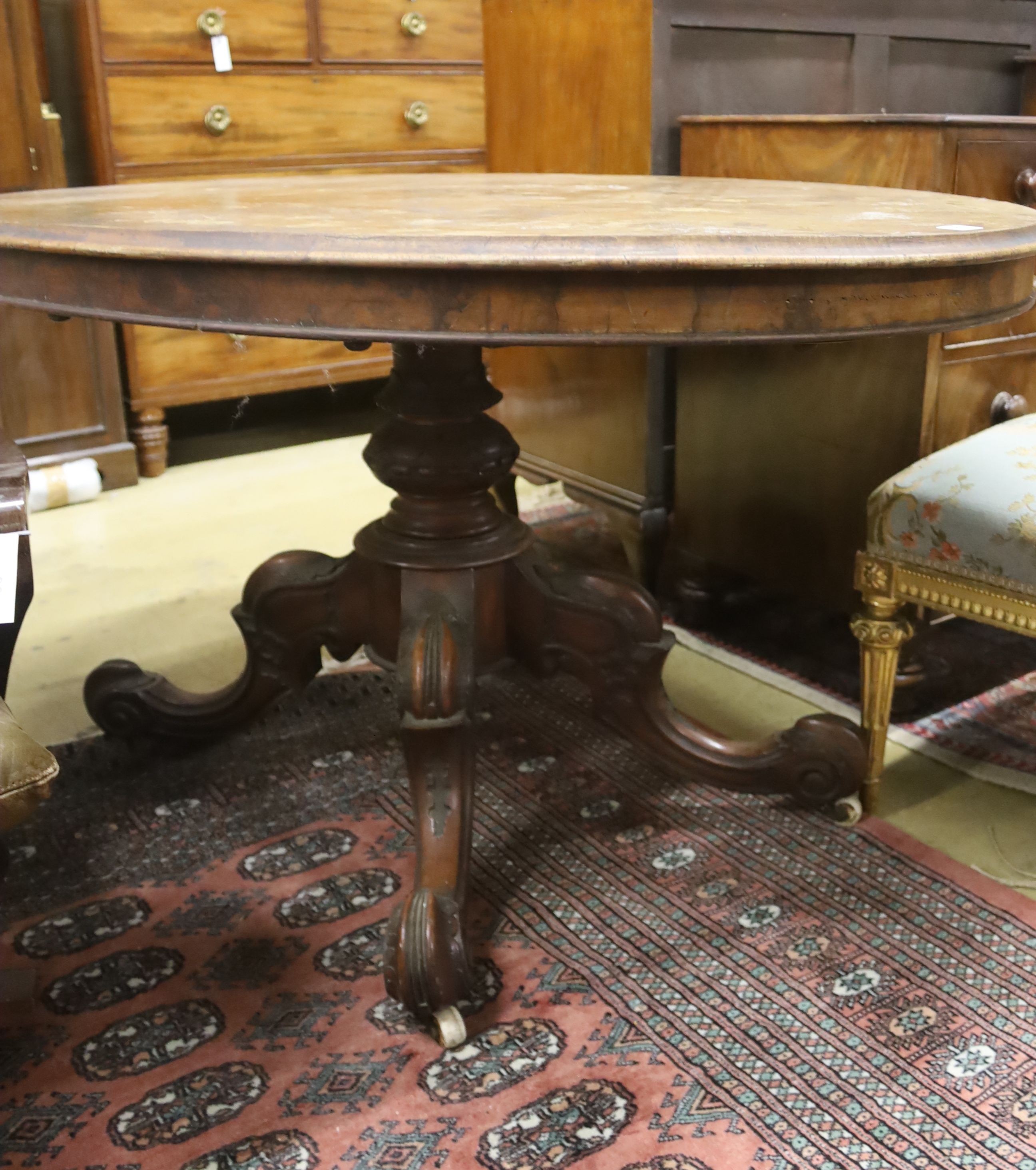 A Victorian oval figured walnut tilt top loo table, width 135cm, depth 100cm, height 72cm